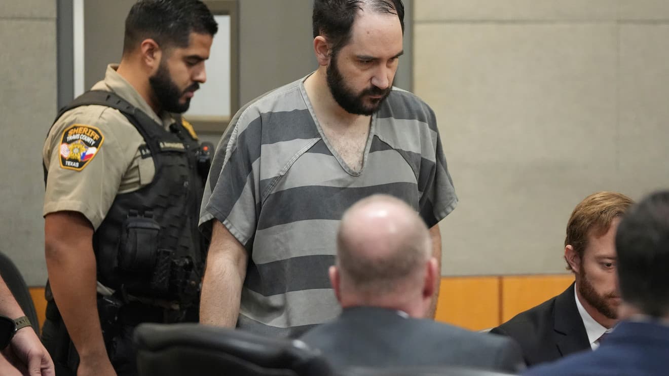Daniel Perry enters an Austin courtroom