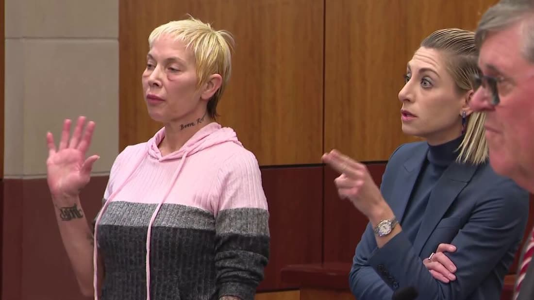 Kim Mathers seated in court beside her attorney