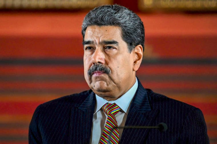 Nicolas Maduro speaking at a podium