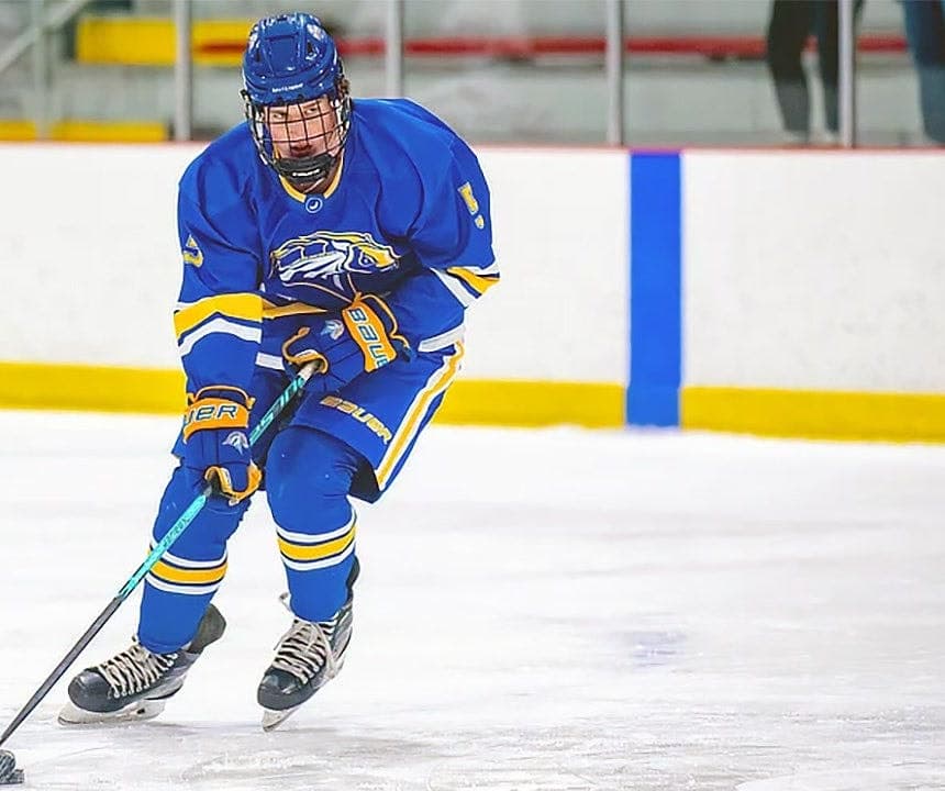 Ryan O'Shea skating in a University of New Haven hockey jersey